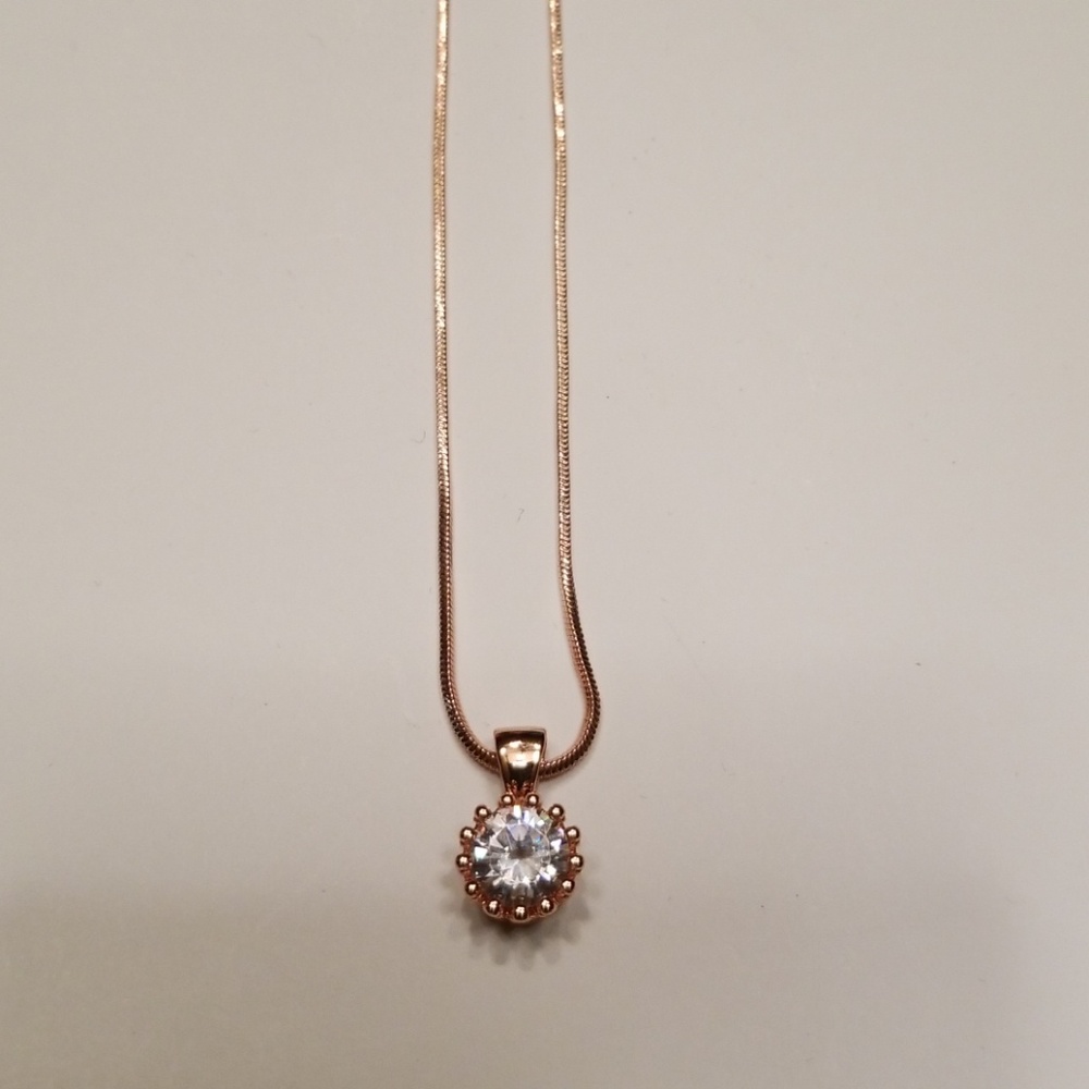 CZ and rose gold pendant with matching chain.